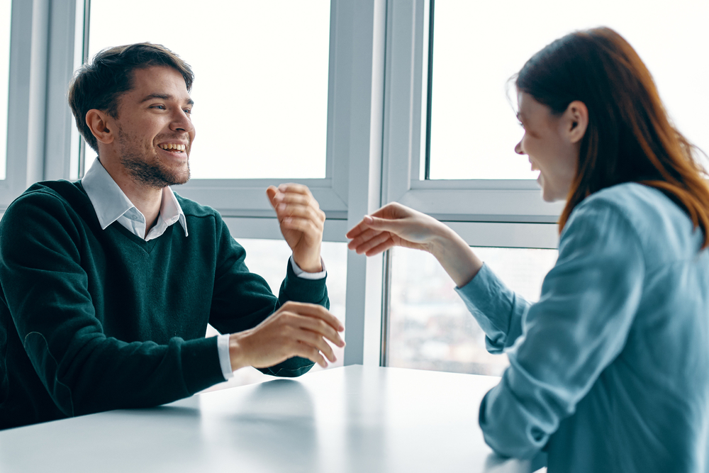 Image of two people engaging in dialogue