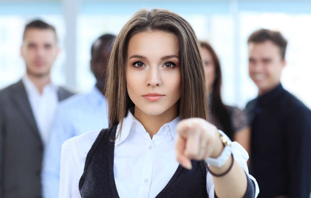 Image of a woman pointing a finger at you symbolising the importance of what you do and leading by example